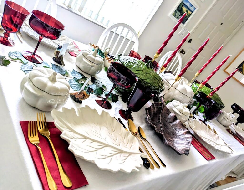 Angled view of a dinner table with leaf and pumpkin dishware.